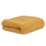 Manta de tricot mostaza