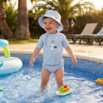 Gorro con protección solar 0-6 meses Navy Hugs - Imagen 5
